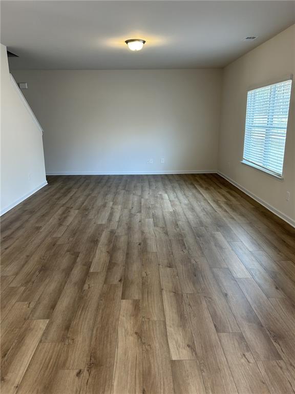 23 Whistling Oaks NE Drive Rome, GA 30165 - Photo 9 of 26 an empty room with wooden floor and windows