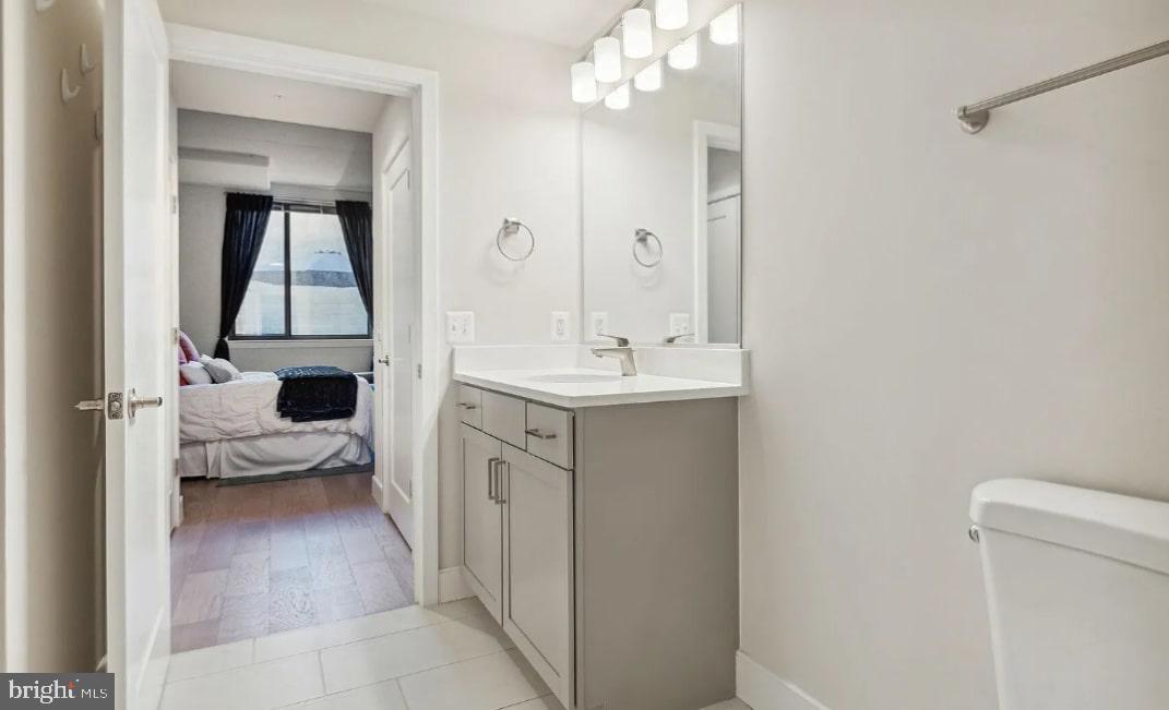 50 Florida Avenue Northeast, Unit 112 Washington, DC 20002 - Photo 7 of 15 a en suite bathroom with a sink a mirror and a shower
