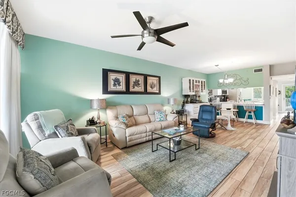 a living room with furniture and a rug