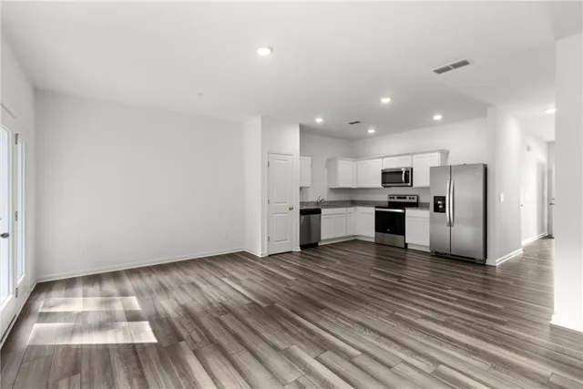 a view of kitchen with wooden floor
