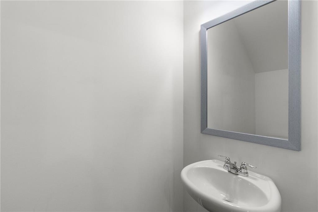 509 Magnolia Circle Palmetto, GA 30268 - Photo 10 of 24 a bathroom with a sink and a mirror