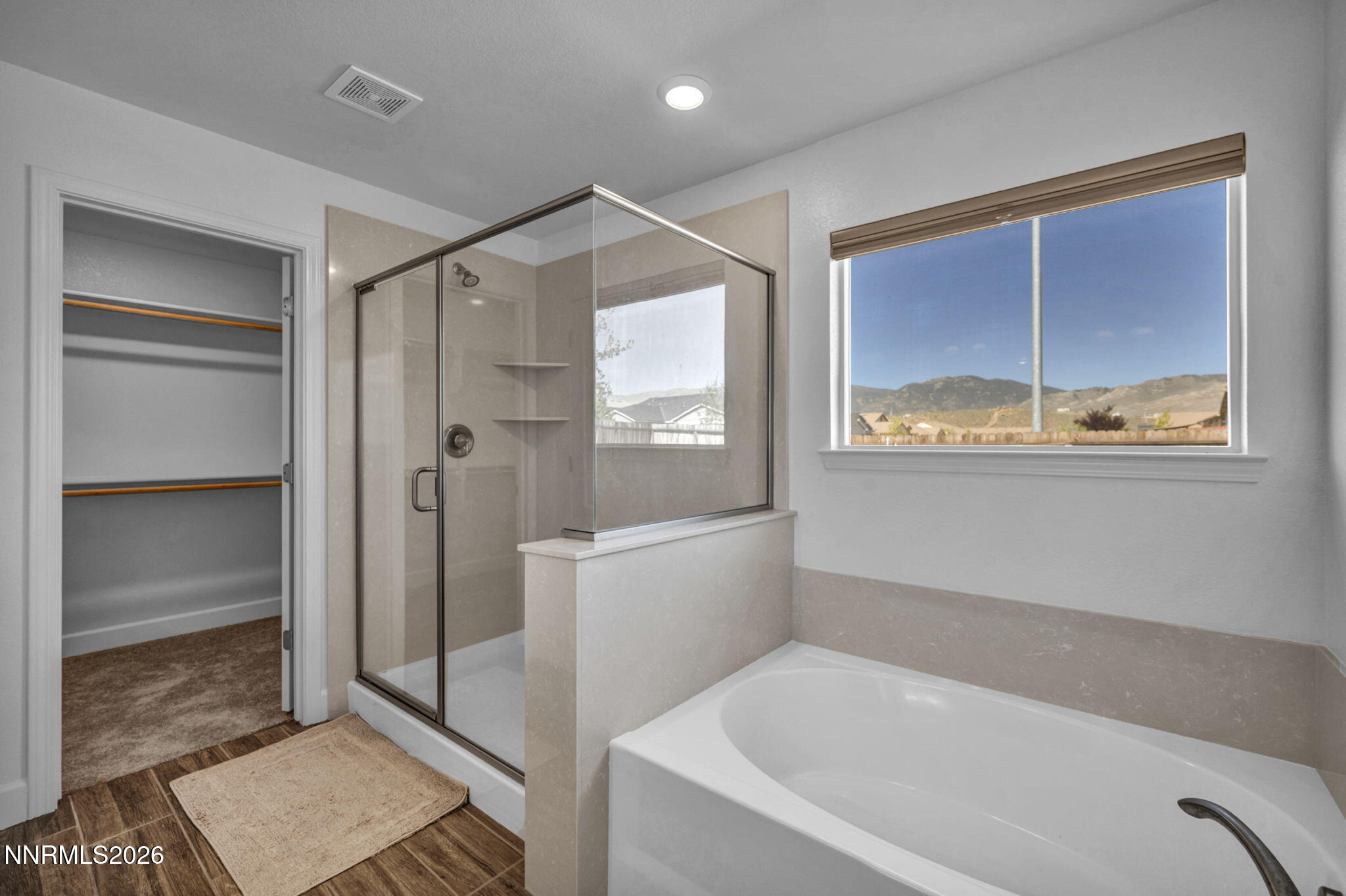 7181 Saddlehorn Road Carson City, NV 89701 - Photo 39 of 62 a bathroom with a bathtub and a shower