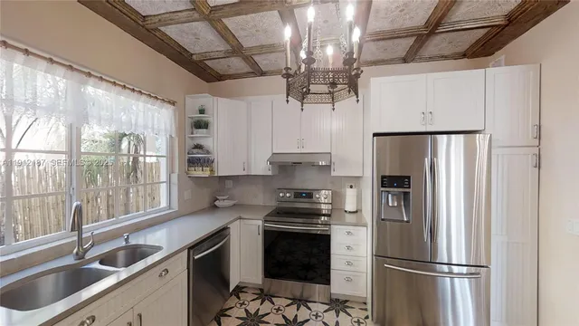 a bathroom with a sink a toilet a window and mirror