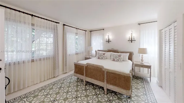 a bedroom with a bed and a television