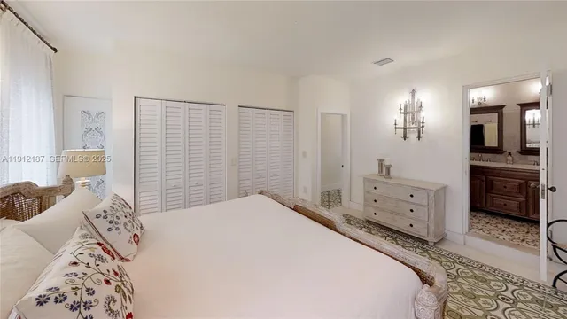 a bathroom with a sink a vanity and a shower