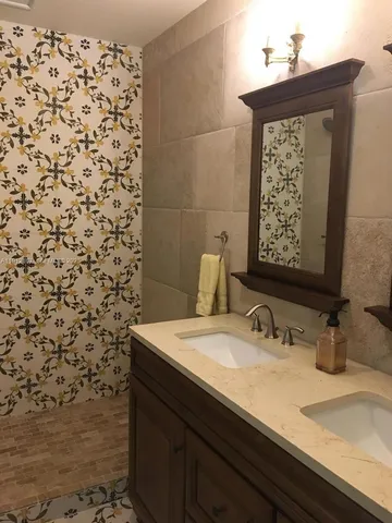 a bedroom with furniture and a chair