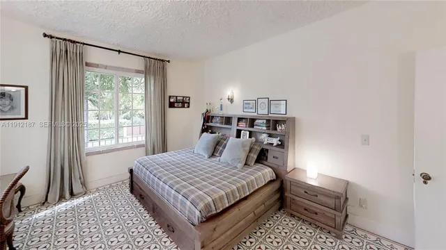 a bathroom with a sink toilet and mirror