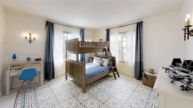 a bedroom with furniture and a wooden floor