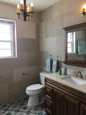 a bathroom with a bathtub sink and toilet
