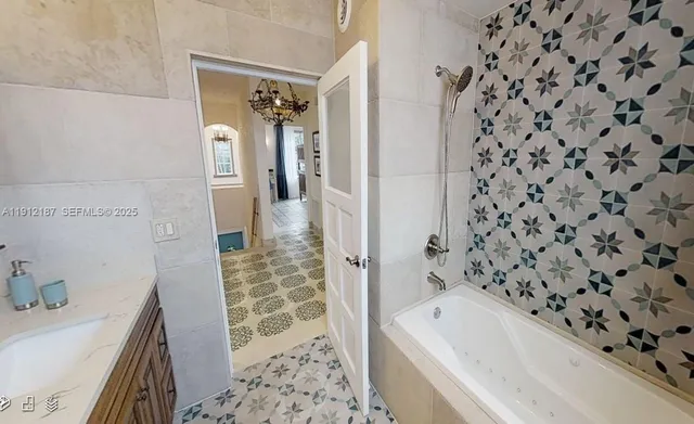 a view of a porch with chairs and potted plants