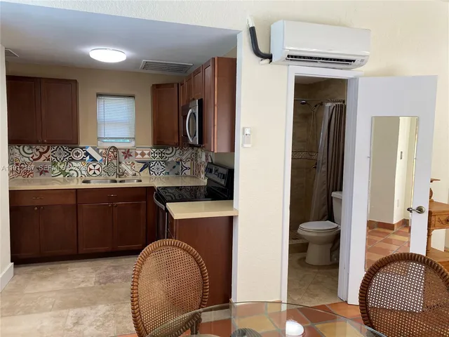 a living room with furniture and a mirror