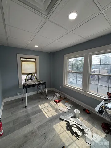 a living room with furniture a rug and a large window