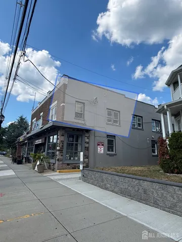 a view of a building with a street