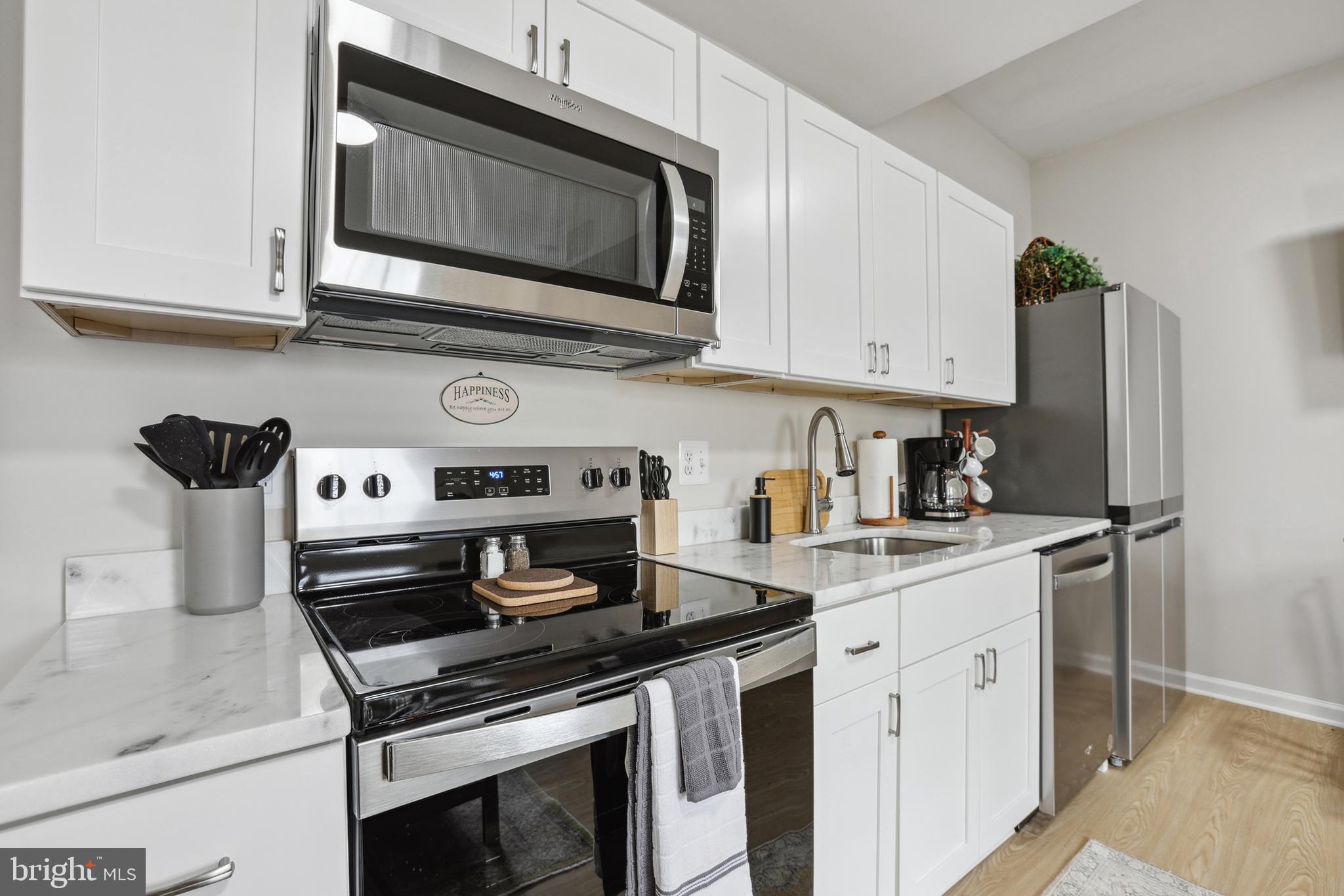 1900 Princess Anne Street, Unit 5 Fredericksburg, VA 22401 - Photo 12 of 19 a kitchen with stainless steel appliances granite countertop grey cabinets a stove a sink and dishwasher