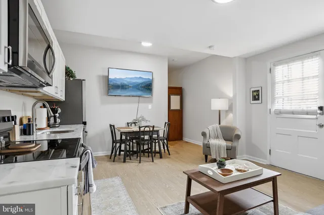 a view of a dining room with furniture and window