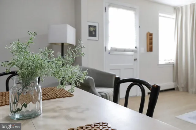 a bathroom with a toilet sink vanity and mirror