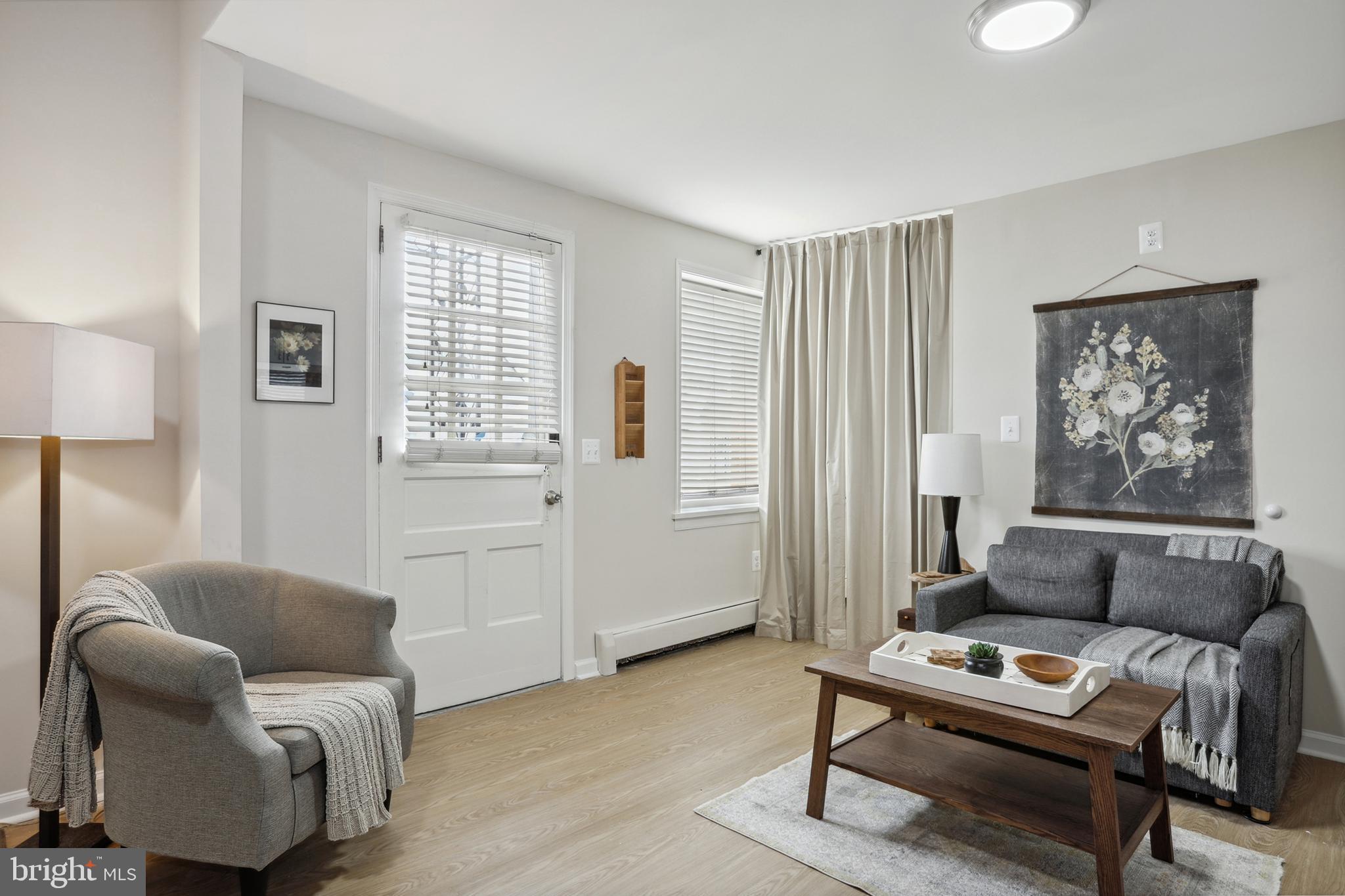 1900 Princess Anne Street, Unit 5 Fredericksburg, VA 22401 - Photo 4 of 19 a living room with furniture and a window