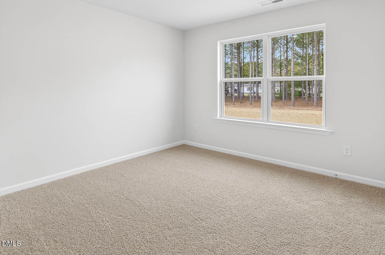 8535 Beckett Chase Way Raleigh, NC 27616 - Photo 19 of 33 an empty room with a window