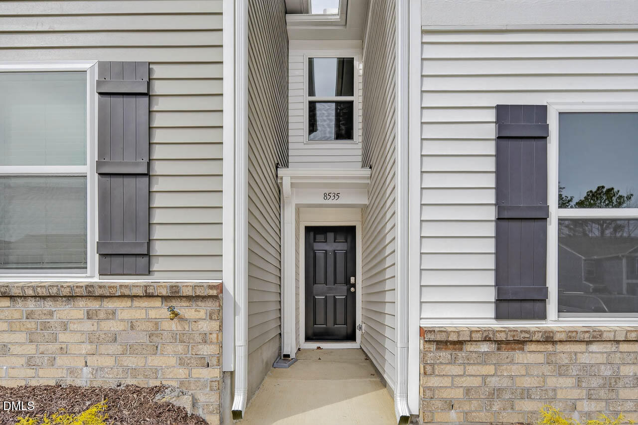 8535 Beckett Chase Way Raleigh, NC 27616 - Photo 2 of 33 a view of a door house with a door