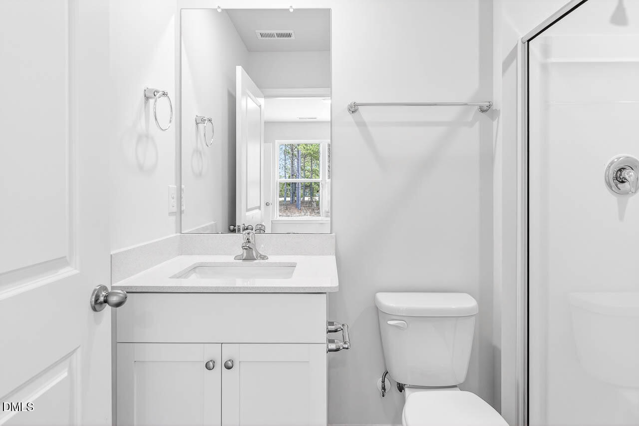 8535 Beckett Chase Way Raleigh, NC 27616 - Photo 23 of 33 a bathroom with a sink toilet and shower