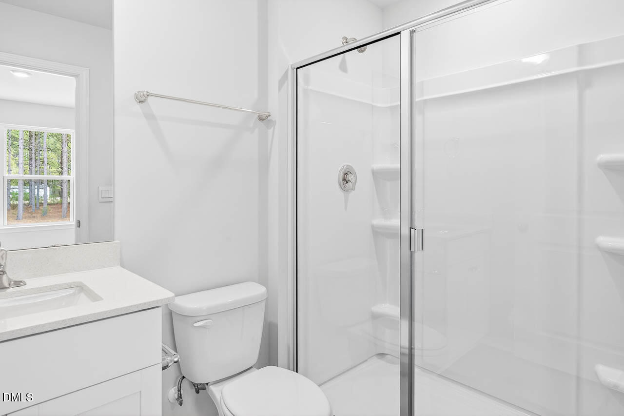 8535 Beckett Chase Way Raleigh, NC 27616 - Photo 24 of 33 a bathroom with a toilet and a shower