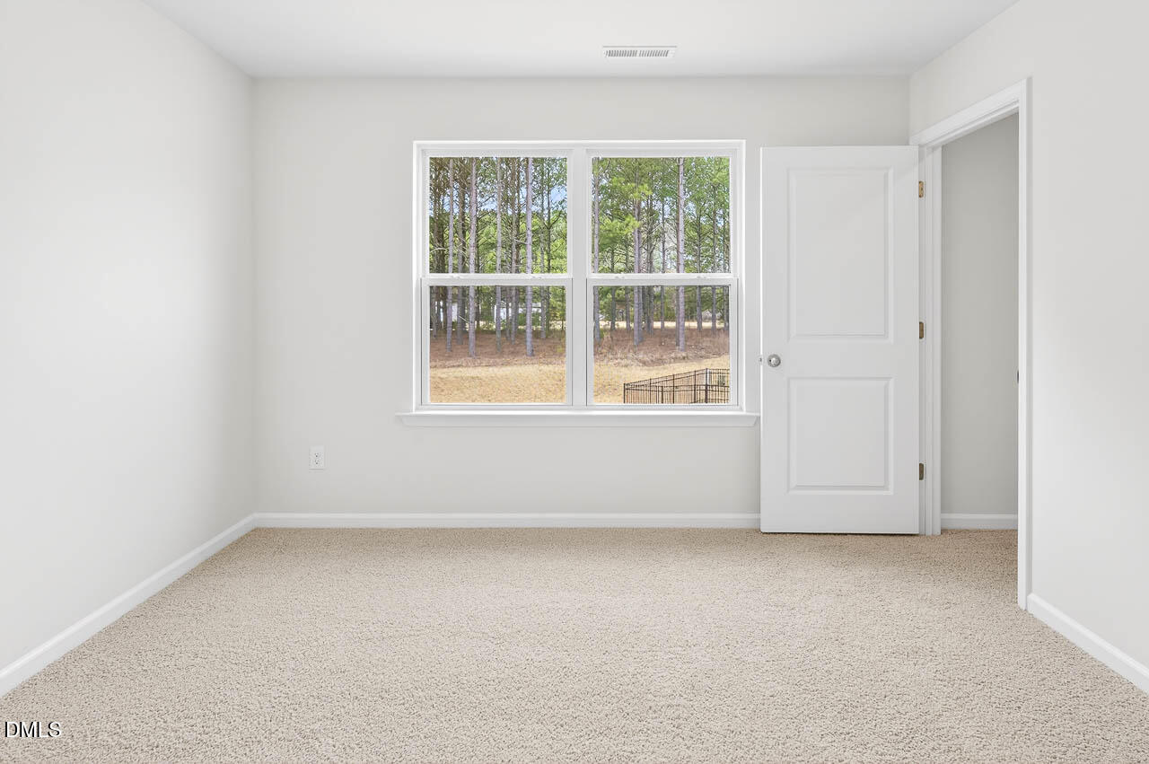 8535 Beckett Chase Way Raleigh, NC 27616 - Photo 25 of 33 an empty room with a window
