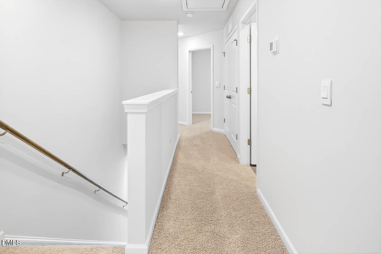 8535 Beckett Chase Way Raleigh, NC 27616 - Photo 26 of 33 a view of a hallway with white walls