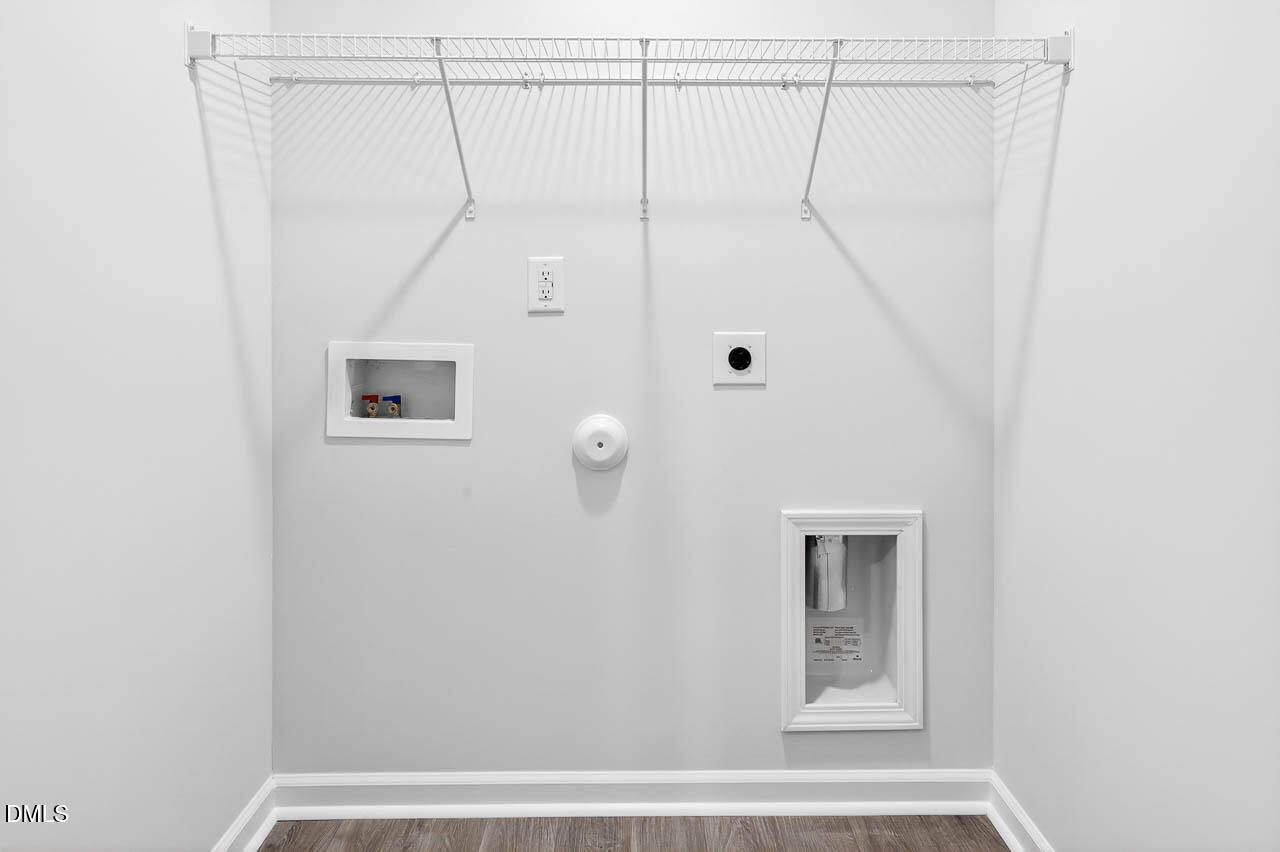 8535 Beckett Chase Way Raleigh, NC 27616 - Photo 28 of 33 a bathroom with a shower and a window