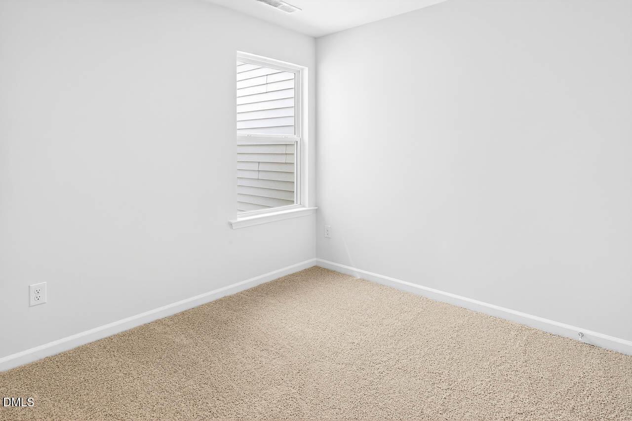 8535 Beckett Chase Way Raleigh, NC 27616 - Photo 29 of 33 an empty room with windows