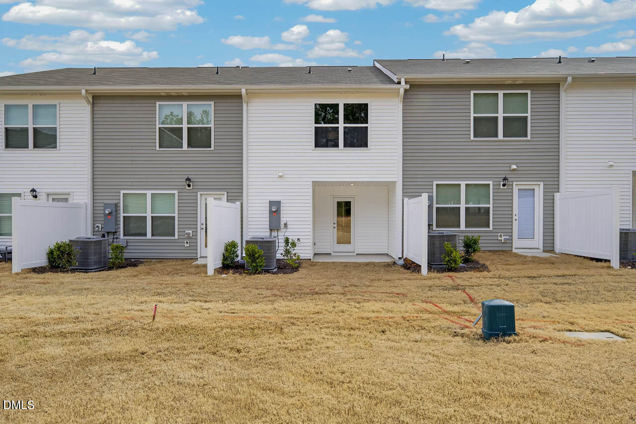 8535 Beckett Chase Way Raleigh, NC 27616 - Photo 3 of 33 a front view of a house with a yard