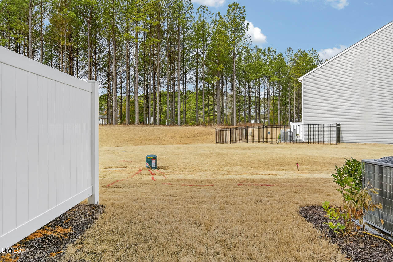 8535 Beckett Chase Way Raleigh, NC 27616 - Photo 4 of 33 a view of swimming pool with a yard and seating area