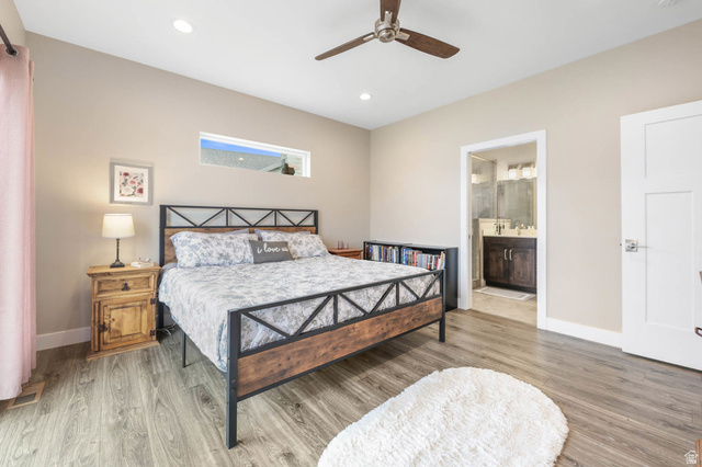 4527 North Seven Bridges Road Eden, UT 84310 - Photo 19 of 65 Bedroom with light wood-style flooring, a ceiling fan, recessed lighting, and ensuite bath