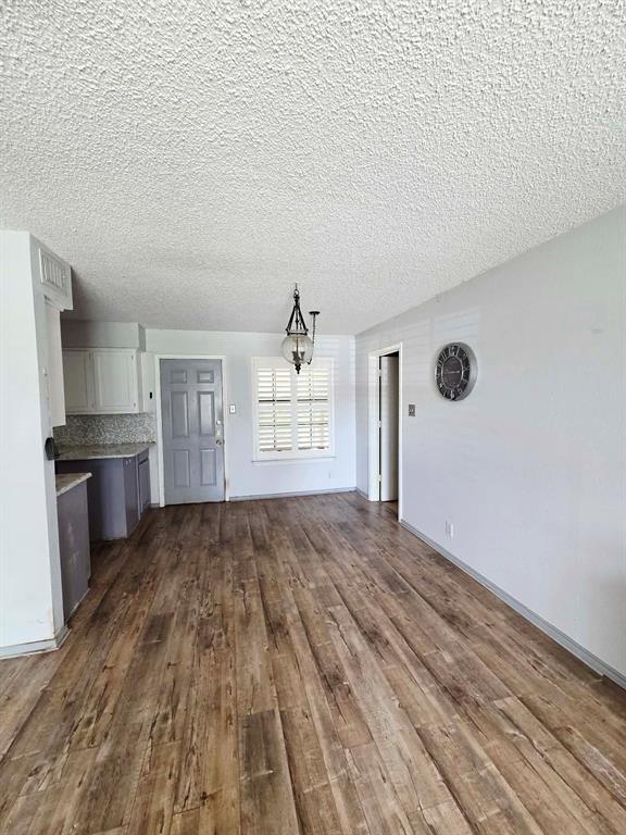 722 South Church Street Pilot Point, TX 76258 - Photo 10 of 37 a view of empty room with wooden floor