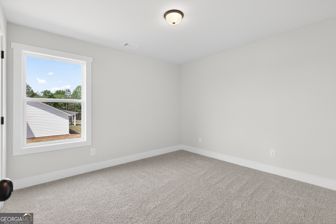 206 Airport Road, Unit 11 Canon, GA 30520 - Photo 31 of 34 an empty room with a window