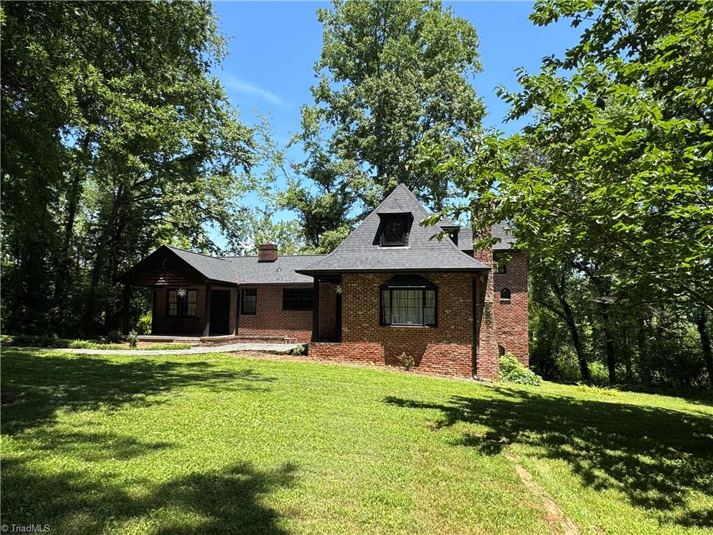 2381 Bethabara Road Winston-Salem, NC 27106 - Photo 21 of 22 with green grass & leaves on the trees