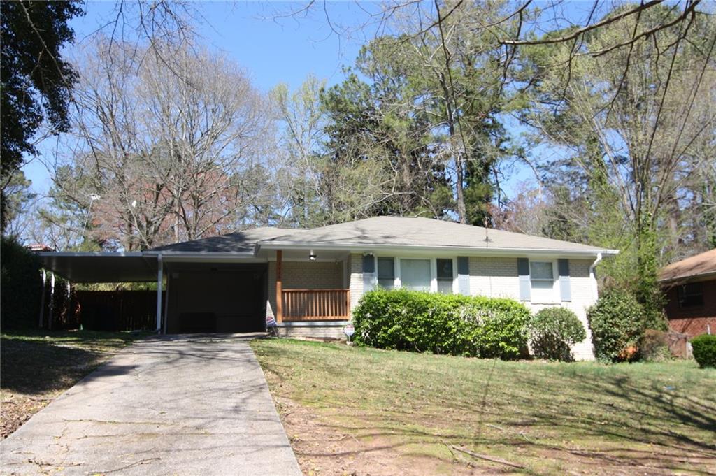 3026 Del Monico Drive Decatur, GA 30032 - Photo 1 of 1 Front with Double Carport. Home has Freshly Painted Fence, Railing, Shutters and Trim