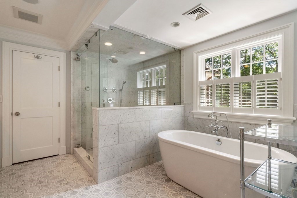 45 Ravine Road Wellesley, MA 02481 - Photo 23 of 42 a spacious bathroom with a tub shower and windows
