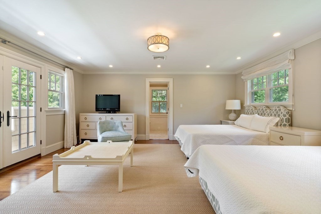 45 Ravine Road Wellesley, MA 02481 - Photo 25 of 42 a bed room with a bed a window and a television