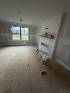 a room with water heater and white walls