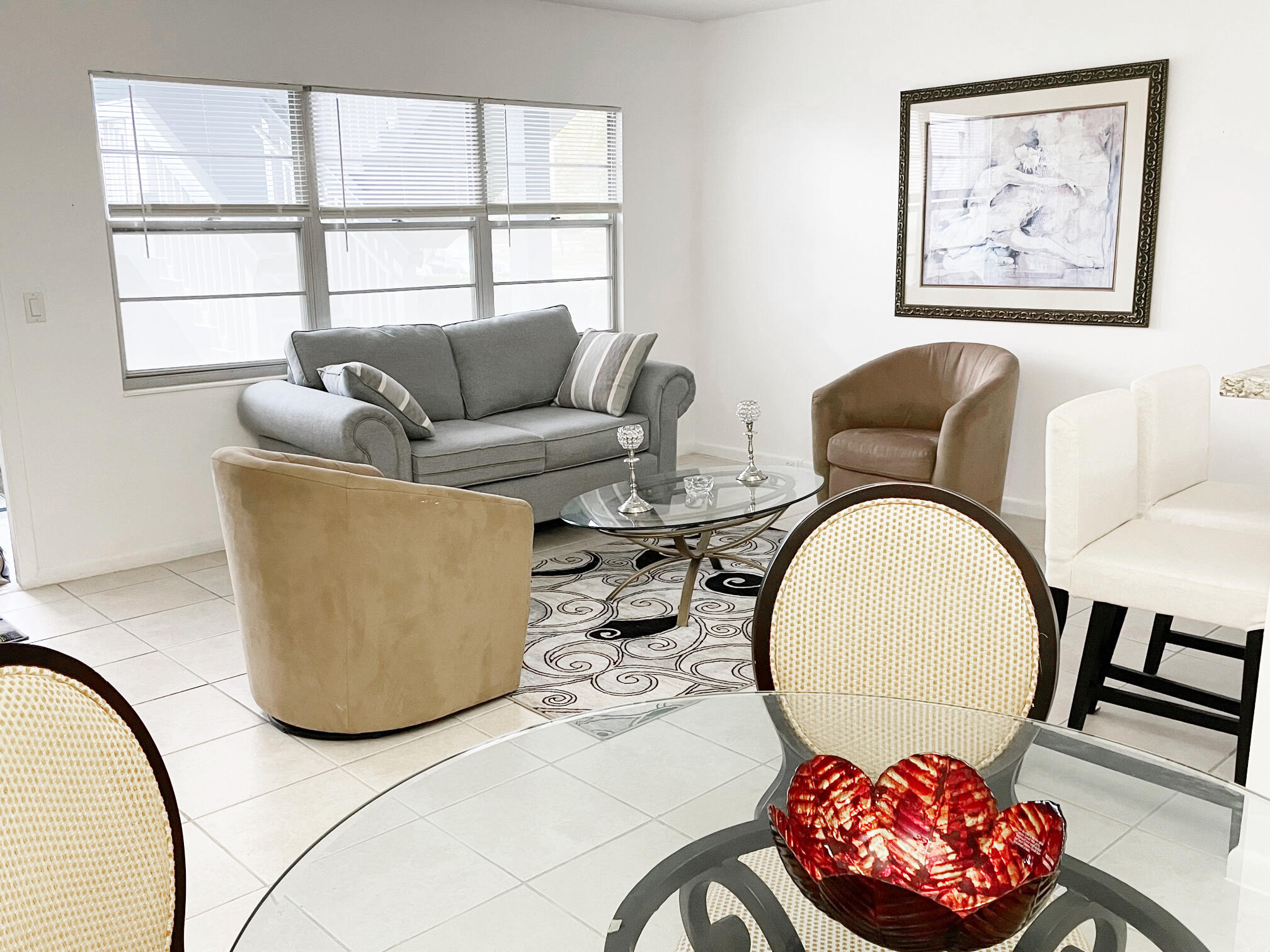 171 Suffolk F, Unit 171 Boca Raton, FL 33434 - Photo 5 of 21 a living room with furniture and window