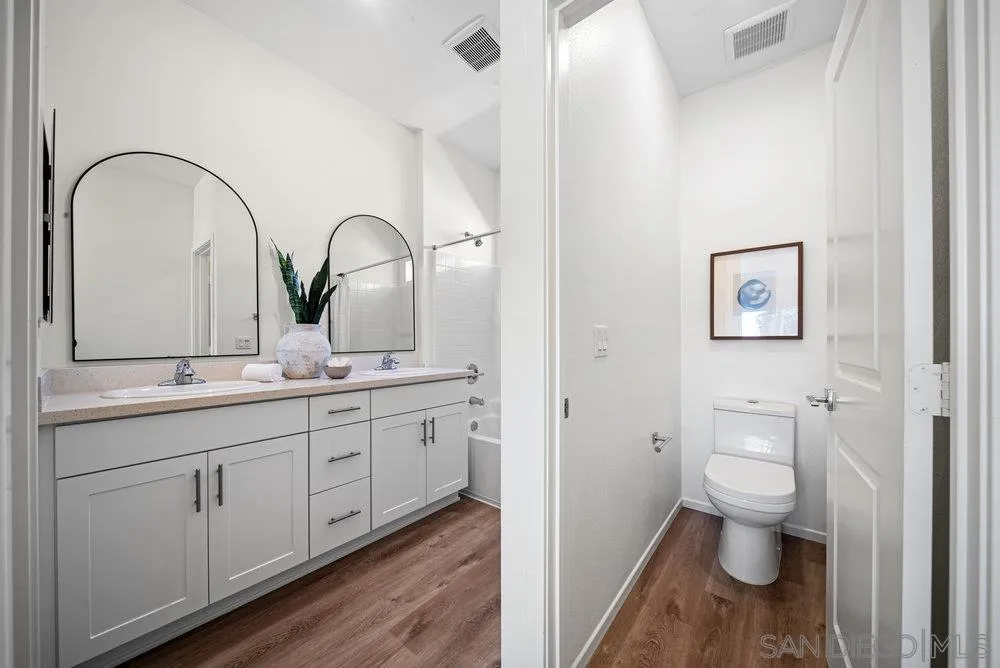 8174 Golden Avenue Lemon Grove, CA 91945 - Photo 23 of 50 a bathroom with a toilet sink and mirror