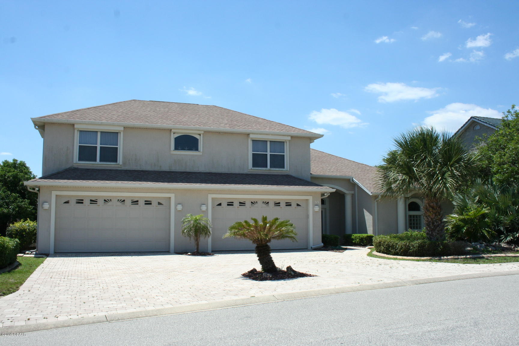 35 Inlet Point Boulevard Ponce Inlet, FL 32127 - Photo 1 of 34 a front view of a house with a yard