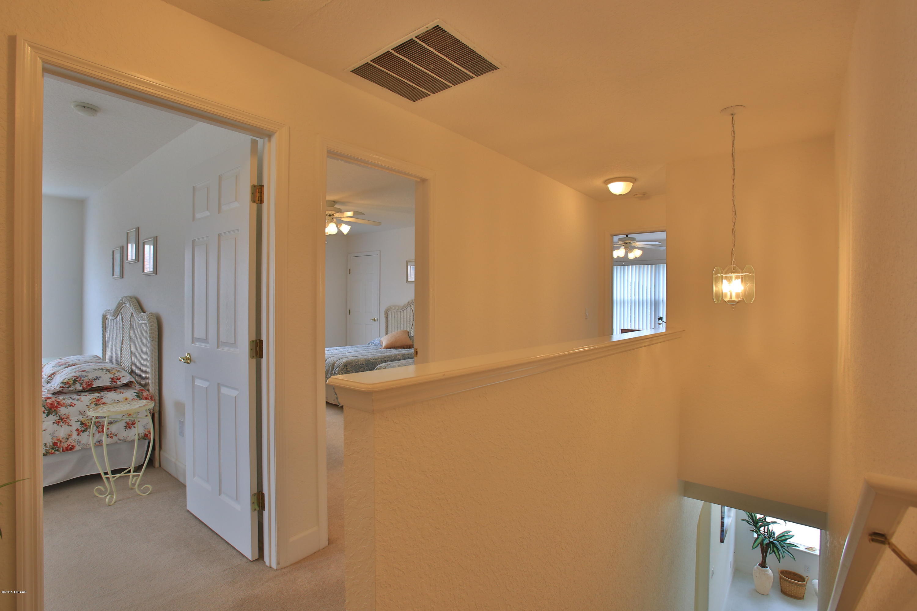 35 Inlet Point Boulevard Ponce Inlet, FL 32127 - Photo 23 of 34 a en suite bathroom with a sink and a mirror