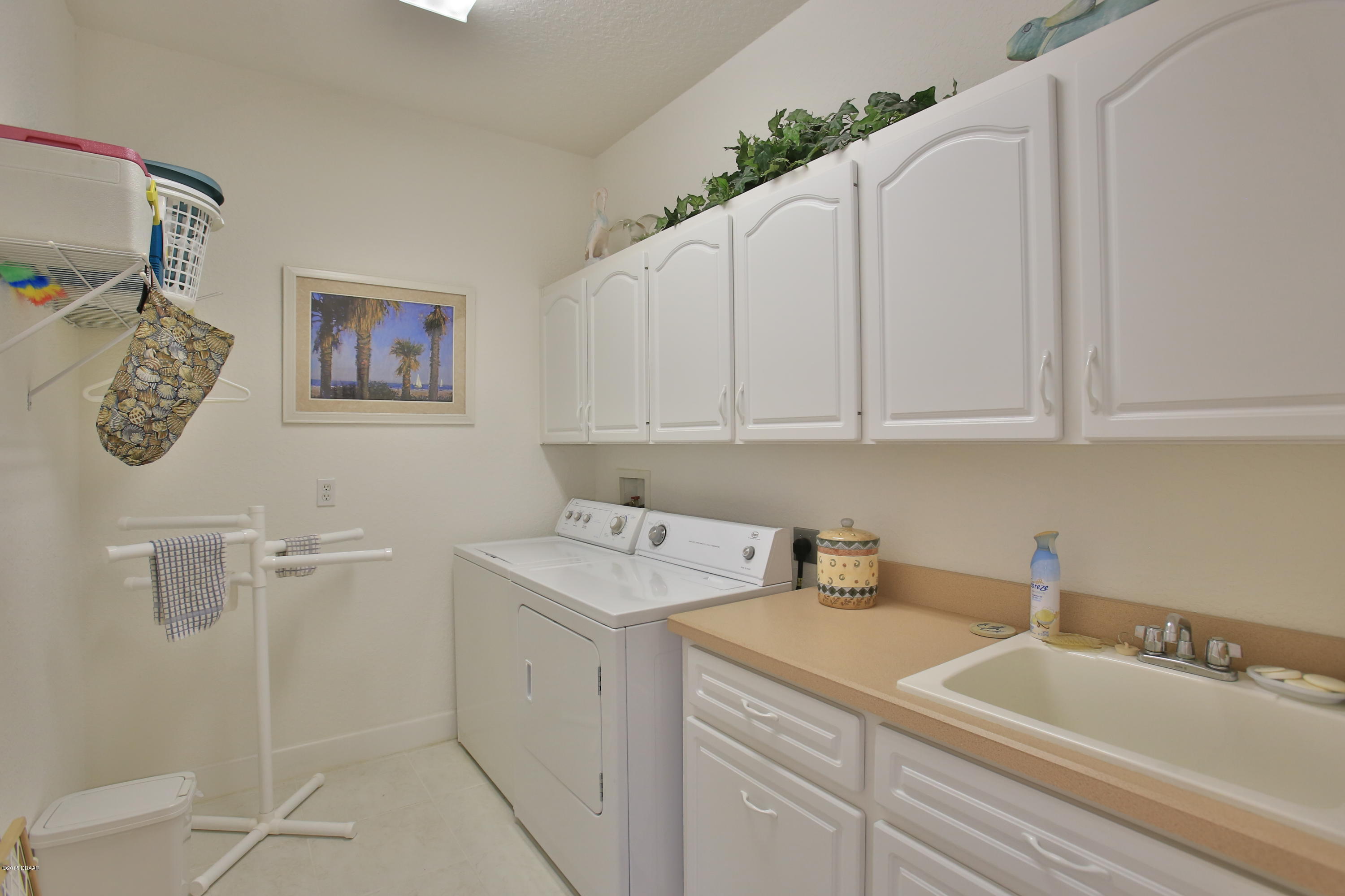 35 Inlet Point Boulevard Ponce Inlet, FL 32127 - Photo 24 of 34 a bathroom with a sink and a toilet
