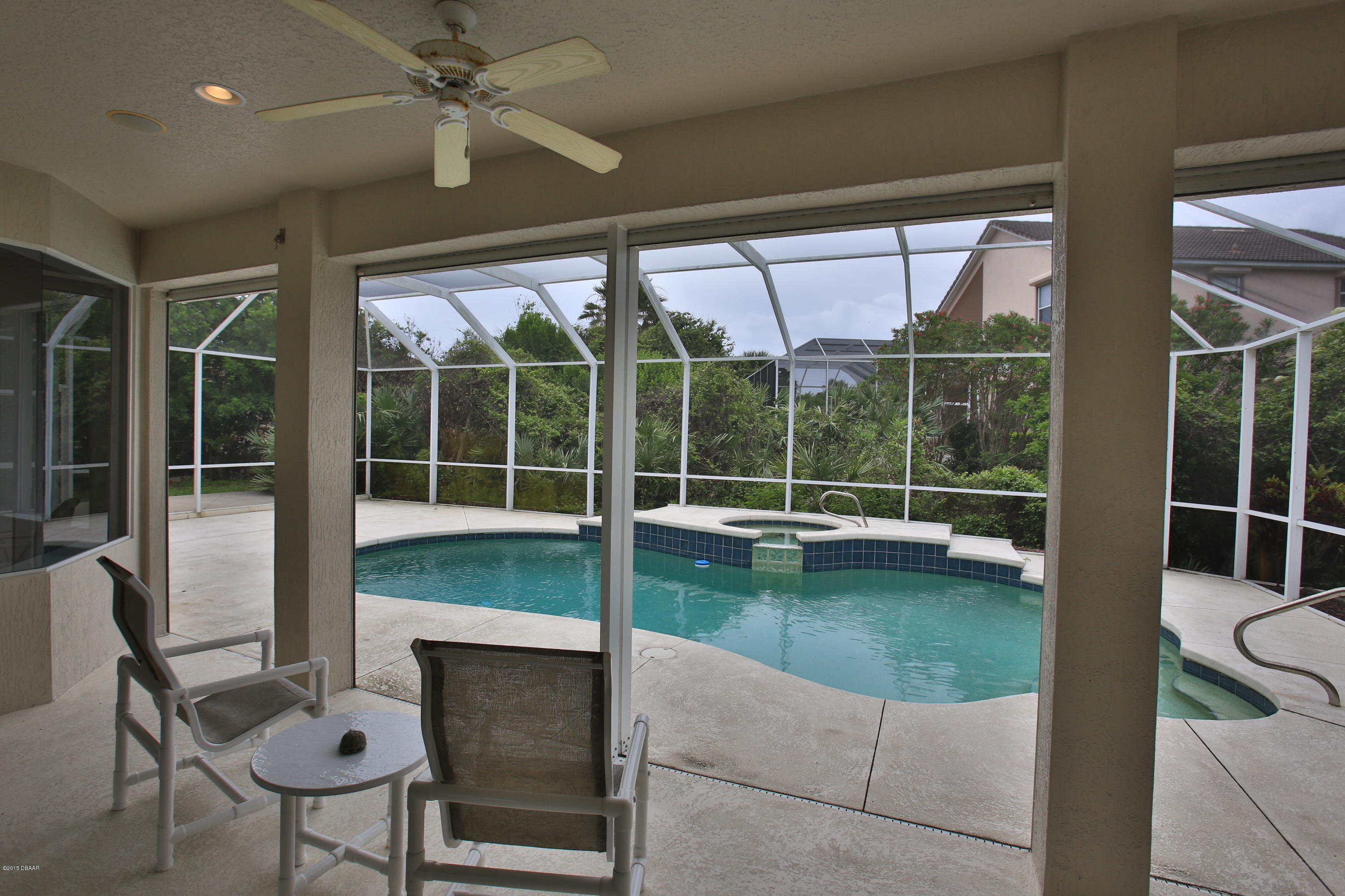 35 Inlet Point Boulevard Ponce Inlet, FL 32127 - Photo 28 of 34 a living room with hardwood floor and balcony view