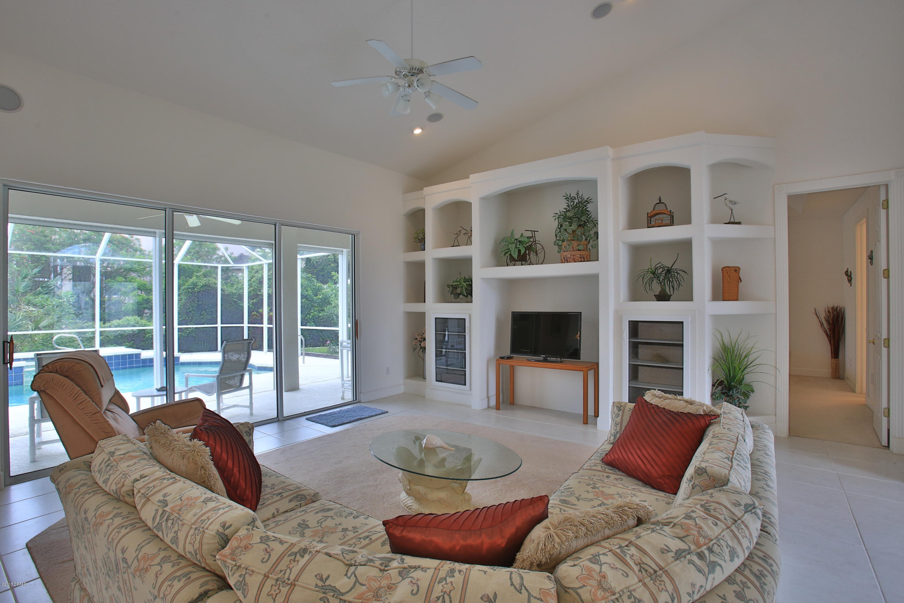 35 Inlet Point Boulevard Ponce Inlet, FL 32127 - Photo 4 of 34 a living room with furniture and a large window