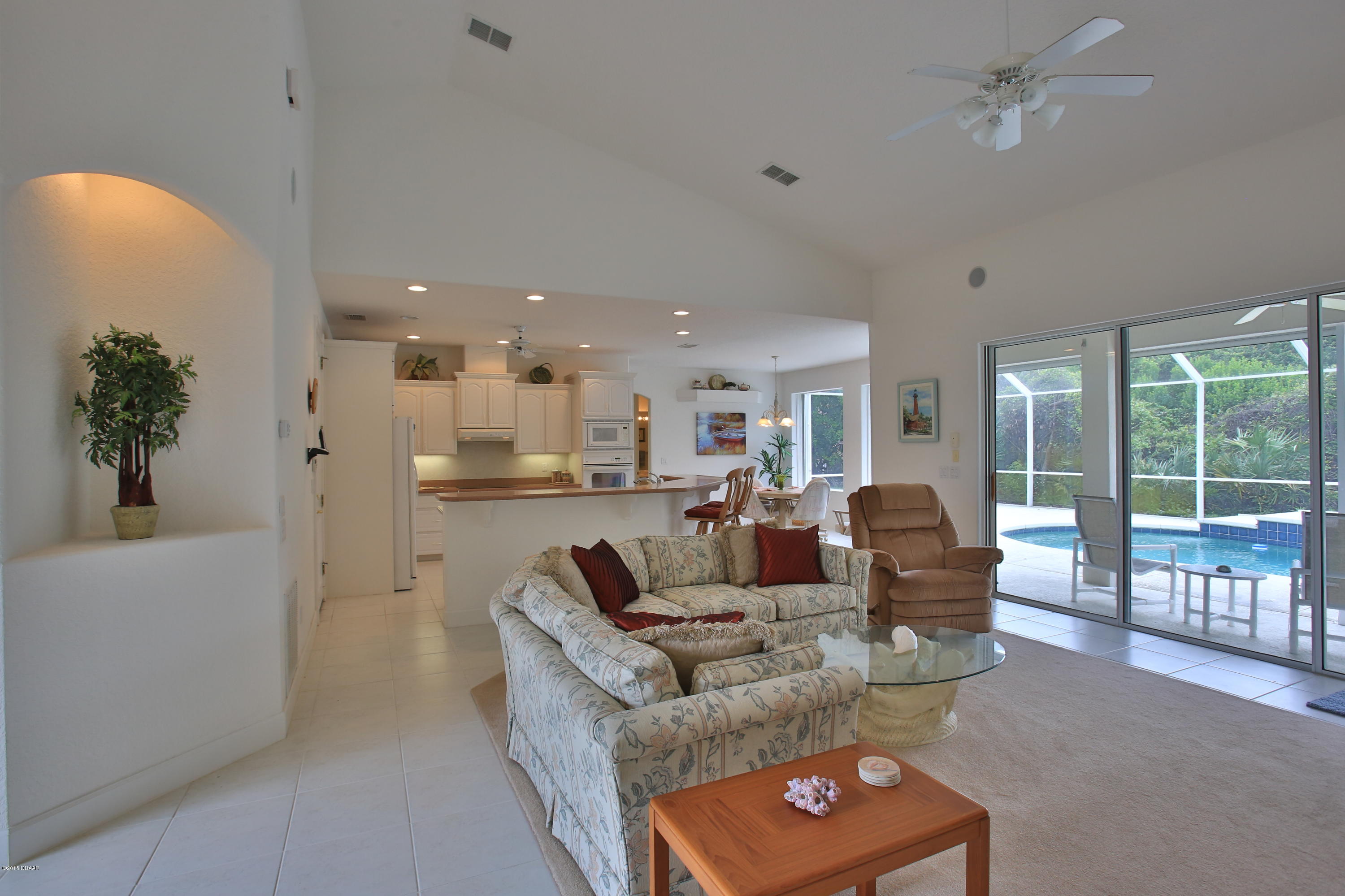 35 Inlet Point Boulevard Ponce Inlet, FL 32127 - Photo 34 of 34 a living room with furniture and a large window