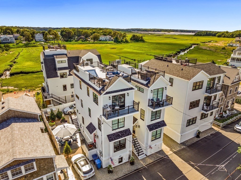 83 Glades Road Scituate, MA 02066 - Photo 1 of 37 an aerial view of residential building with ocean view