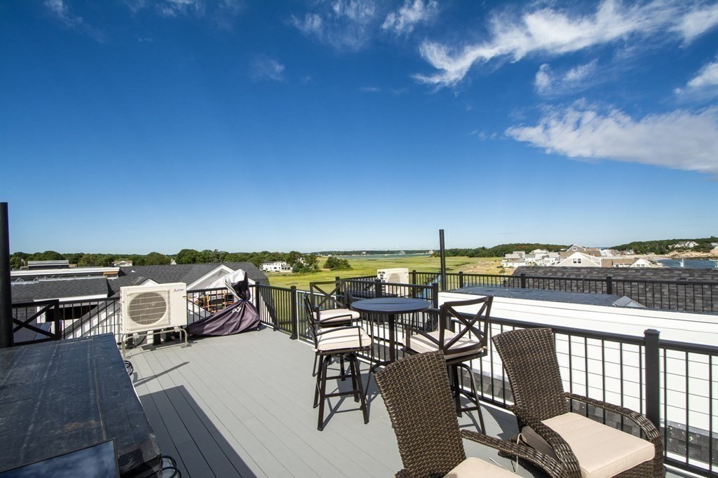 83 Glades Road Scituate, MA 02066 - Photo 20 of 37 a view of a terrace with furniture and stove