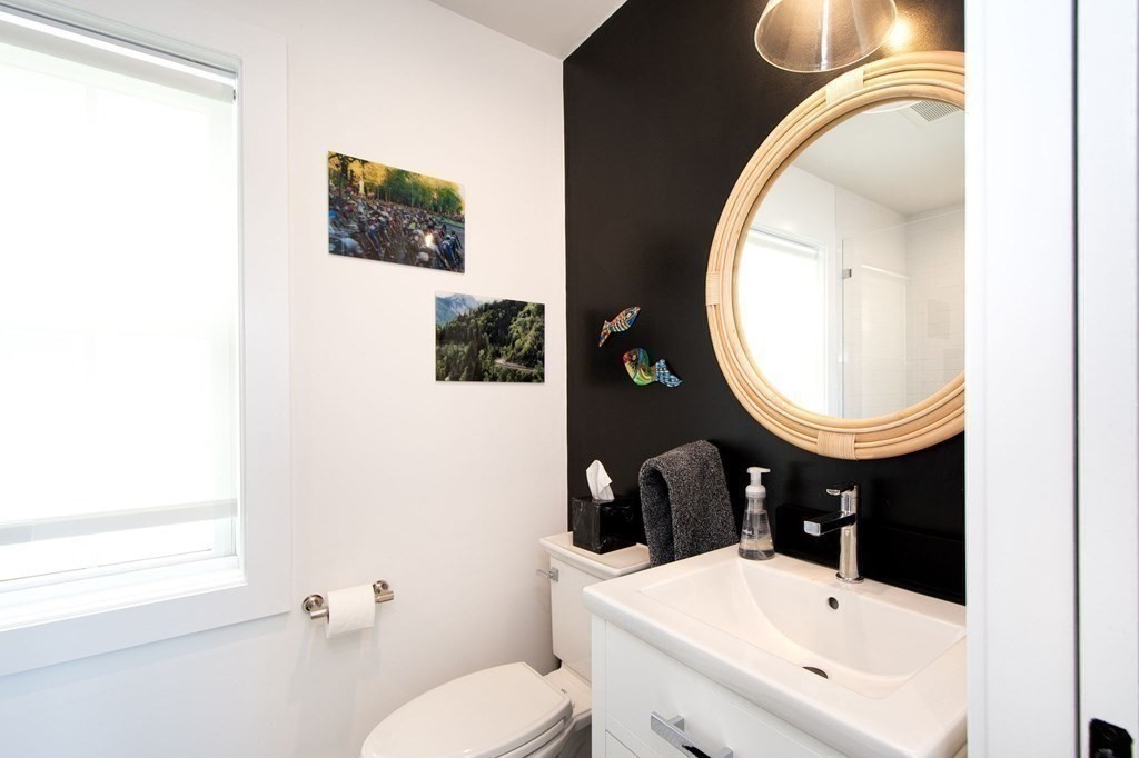 83 Glades Road Scituate, MA 02066 - Photo 21 of 37 a bathroom with a sink a toilet and a mirror